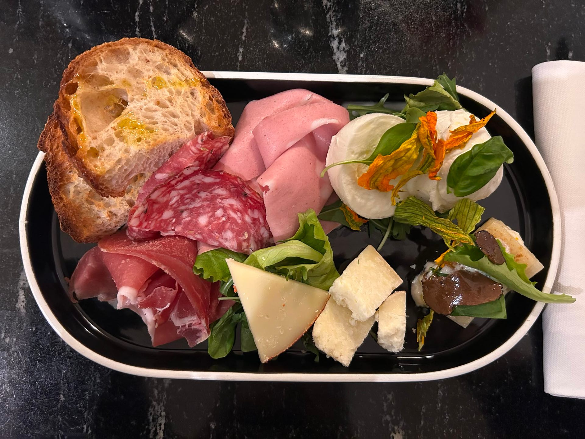 Charcuterie and cheese board with bread