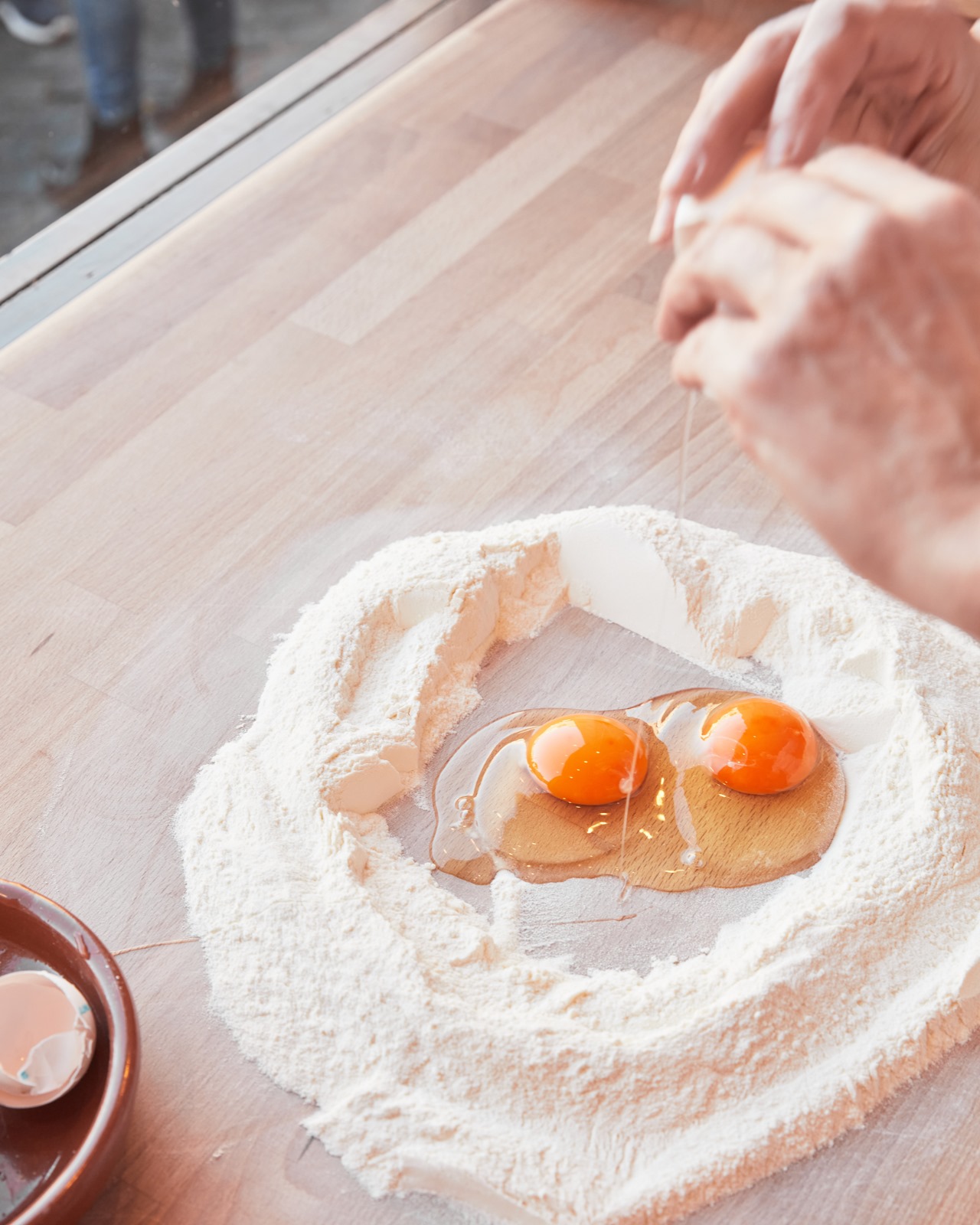 Flour well with two fresh egg yolks